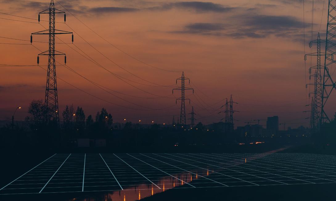 Dusk photo of powerlines, with a square grid diagram overlaid on the ground.